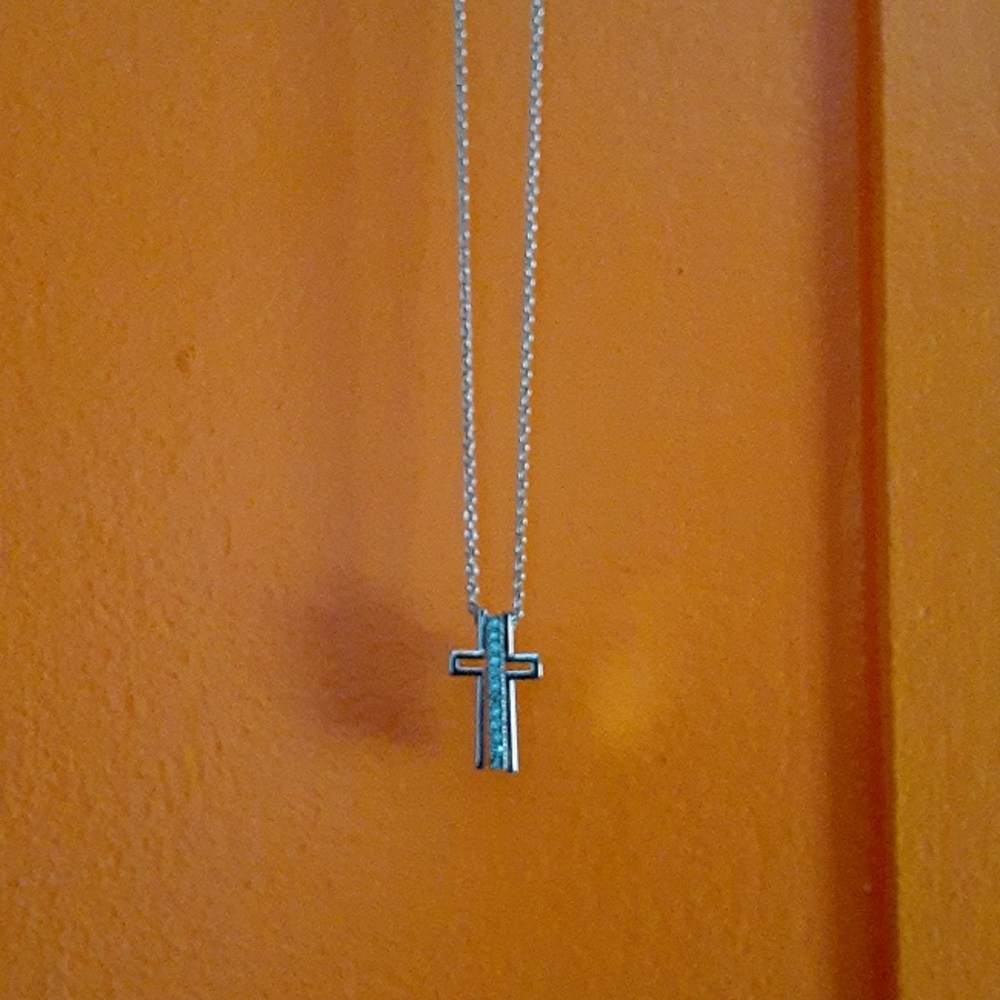 Cross necklace w/blue topaz stones.